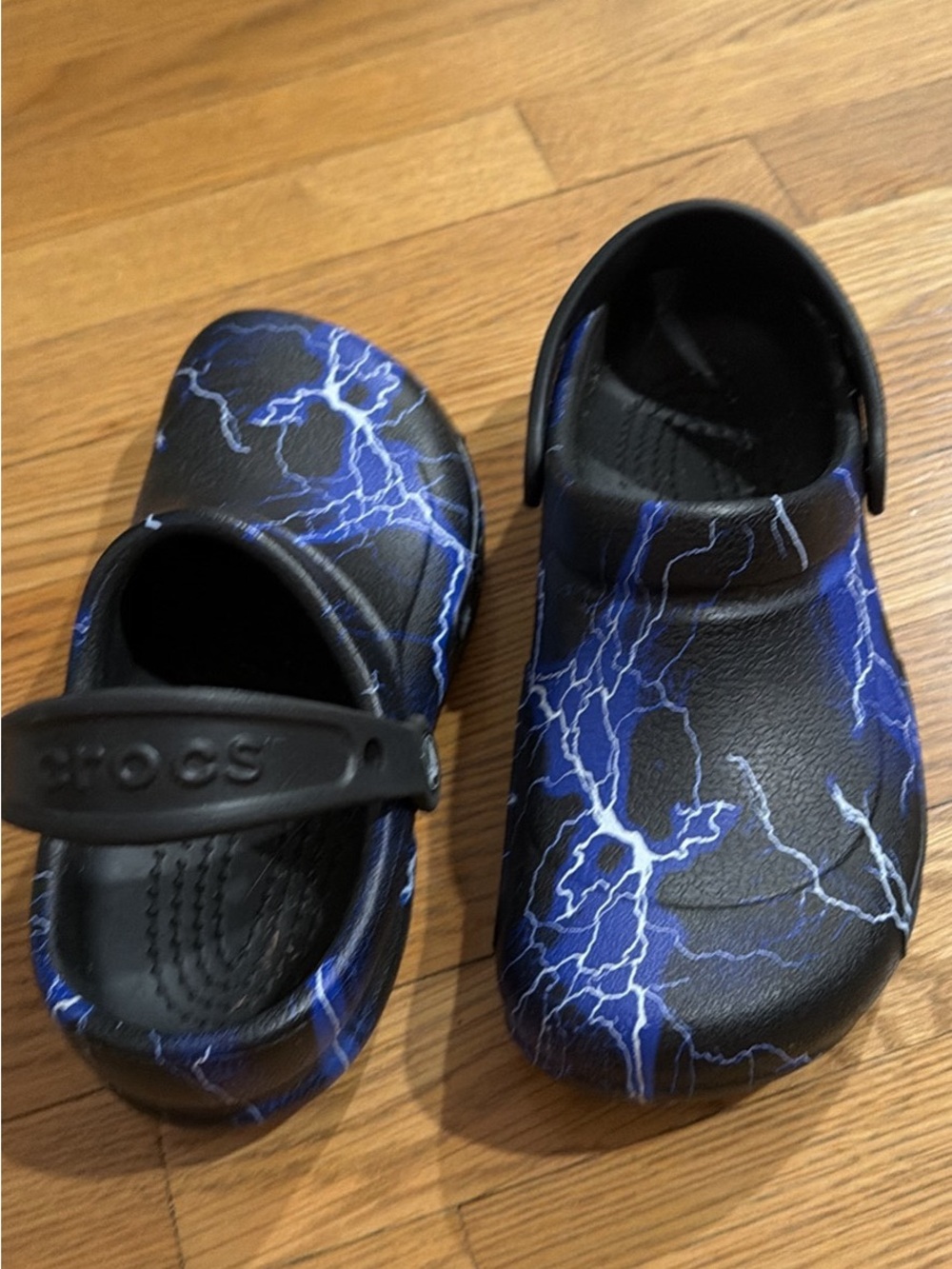 CROCS Kids Black Clogs with Blue Lightning Print